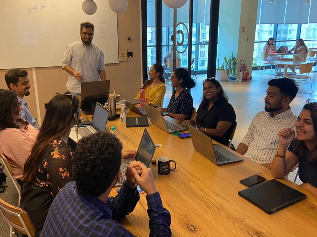 Shobhit Gupta, standing, leading a strategy and planning session with the GoComet sales team